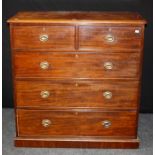 An early 19th century mahogany chest, the rectangular top with moulded edge over two short and three