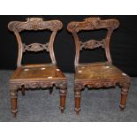 A pair of early 19th century Anglo-Indian Colonial hardwood childs chairs, each with scrolled,