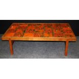 A circa 1970's Danish teak framed coffee table with green/red tile inset top, 43 x 146 x 86cm