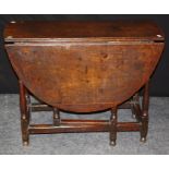 A late 18th century oak gateleg table of small proportions, the rectangular top and half moon drop