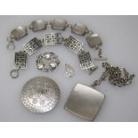 A small quantity of Georg Jensen pewter jewellery including two bracelets, a large pendant, a
