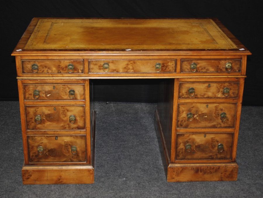 A good reproduction burr yew twin pedestal writing desk, the rectangular scriber set top over an