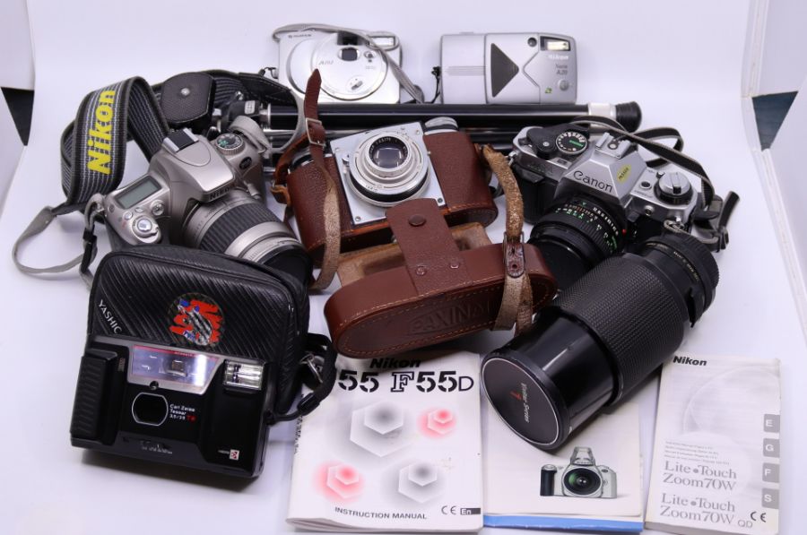 A collection of cameras to include vintage Series1, 70-210 zoom with Macro, Nikon F55 SLR, Canon