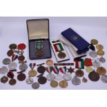 A large collection of medals and medallions to include an American Military Merit cased