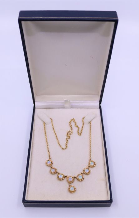 **WITHDRAWN**A gold and Opal necklace