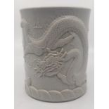 An interesting Blanc De Chine Chinese Bitong  depicting Fierce dragon roaming the skys, Impressed