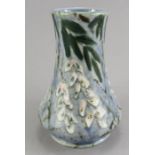 A twentieth century Cobridge Pottery floral pattern vase, by Anita Harris. 16 cm tall. (1)