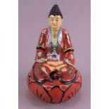 An Continental  porcelain Box  The cover is of Figure of a Buddha Date 20th century Size   16cm high