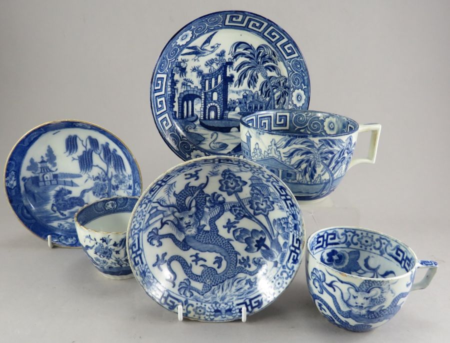 A group of three late eighteenth, early nineteenth century blue and white transfer-printed cups