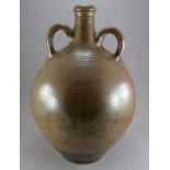 A very large salt glazed stone ware two-handled storage jar, c. 1700-50. It has banded decoration to