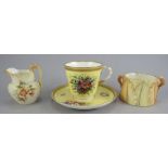 A late nineteenth century Royal Worcester yellow ground porcelain cup and saucer with raised gilding