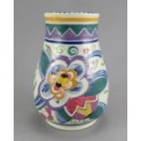 A twentieth century Poole Pottery baluster vase, c. 1930. It is decorated with a floral design by