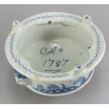 An eighteenth century tin-glazed earthenware blue and white named and dated kettle stand, c. 1787.