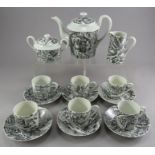 A French porcelain Limoges transfer-printed tea service. It is decorated with townscapes to each