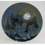A twentieth century Cobridge Pottery large plate decorated with a moonscape. 28 cm wide. (1)