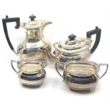 A mid 20th century Elizabeth II silver four-piece tea set, the teapot, sugar bowl and milk jug