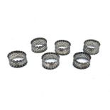 A set of six Victorian pierced oval napkin rings, each with engraved number (6)