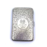 A Victorian cigarette case, scrolling design the central cartouche engraved with a monogram and