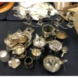 A large collection of silver plated items, to include:- two three stem candlesticks, two small