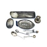 A sterling silver spoon, a silver engine turned rectangular trinket tray, an oval trinket tray, a