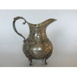 A Persian (Iranian) 840 silver jug with wide spout lip, the entire main body finely chased and