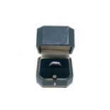 A three stone diamond Ring, total diamond weight approx. 0.10ct. in a box