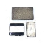 A silver greeting card case with engine turned decoration Birmingham 1916, a white metal cigarette
