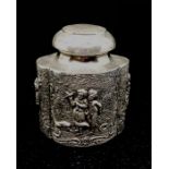 A very decorative German 19th century silver plated tea caddy, repousse design of children in