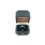 An 18ct. solitaire diamond Ring claw set princess diamond approx 0.20ct. 3.4g. in its box