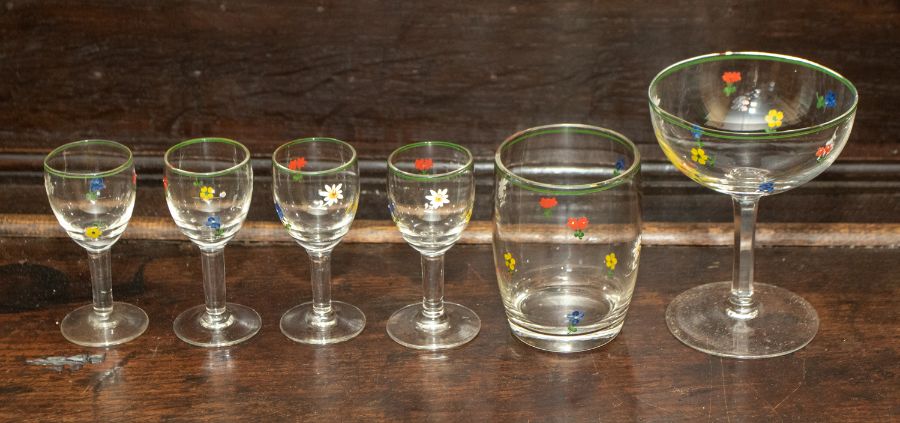 A group of eleven champagne glasses, eight liqueur glasses, two tumblers decorated with polychrome