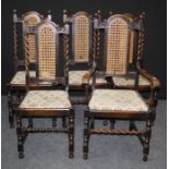 A set of five early 20th century oak dining chairs, each having cane upholstered back, drop in seat,