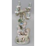 Ernst Bohne and Sohne, a late 19th century Continental porcelain figural four sconce table