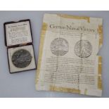 A boxed German Lusitania cast medallion with paper insert, diameter of medal 5.5cm