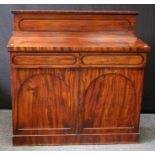 A 19th century mahogany chiffonier with panelled upstand over two frieze drawers and cupboard doors,