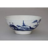 A late 18th century English porcelain tea bowl, decorated in underglaze blue in the oriental manner.