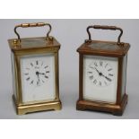 Two early/mid 20th century brass five glass carriage clocks, each with bale handle and Roman dial,