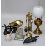 A mixed lot of collectors items including brass paraffin lamp, cast iron scales and weights,