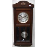 A 1930's oak cased wall clock, the eight day gong striking movement faced by silver Arabic dial,