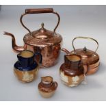 Three Doulton stoneware jugs, each decorated in shallow relief with tavern and hunting scenes, two