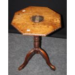 A well carved. late 19th century oak tripod table, the octagonal top with belted fleur de lys