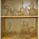 A mixed lot of cut and moulded glassware, including spirit and other decanters, water jug, two