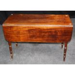 An early 19th century mahogany Pembroke table, the rectangular top and twin flaps with moulded edge,