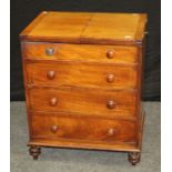 An early 19th century mahogany commode chest, the double hinged top over four false drawers with