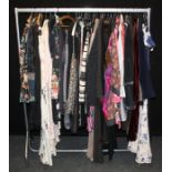 A rail of largely designer branded lady's costume, including All Saints, Ted Baker, Hope and Ivy,