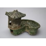 A large Chinese Han Dynasty terracotta farm group with silo and two feeding animals in kidney