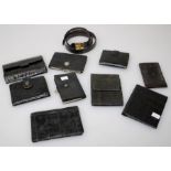 An early 20th century Mappin and Webb black snakeskin purse, eight other similar purses/wallets