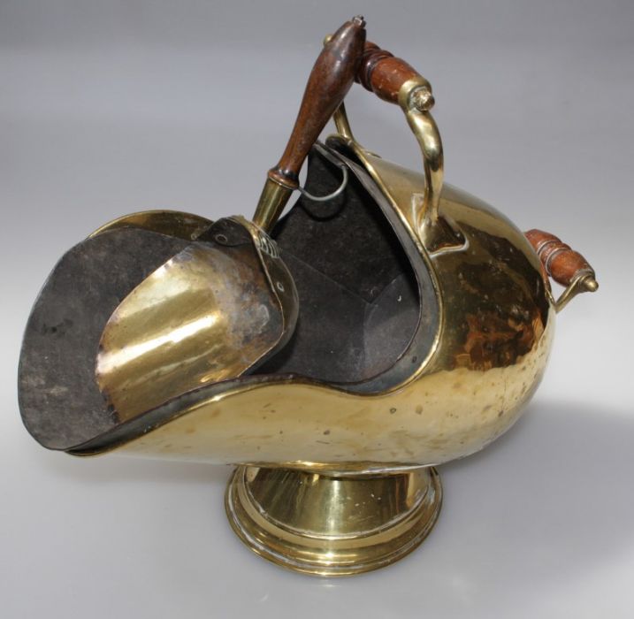 A Victorian brass 'helmet' shape coal scuttle, with turned wood handles, tin liner and an associated - Image 3 of 3