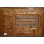 An early 20th century Arts and Crafts carved oak panel, decorated with a beamed drawing room