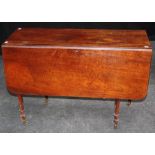 An early 19th century mahogany Pembroke table, the rectangular top and twin flaps, on ring turned