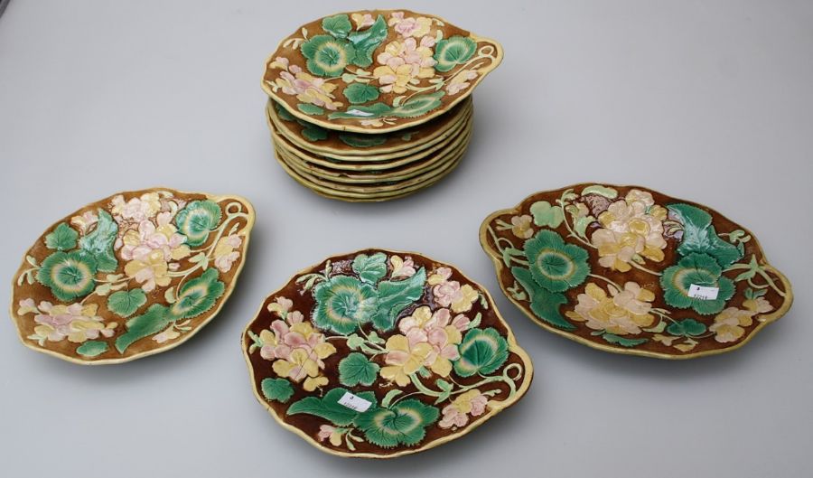 Eight 19th century continental majolica 22cm diameter plates, each florally decorated in shallow